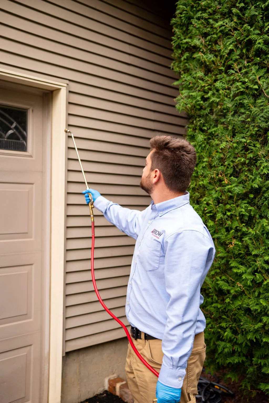 ArrowPestControl person spraying chemical