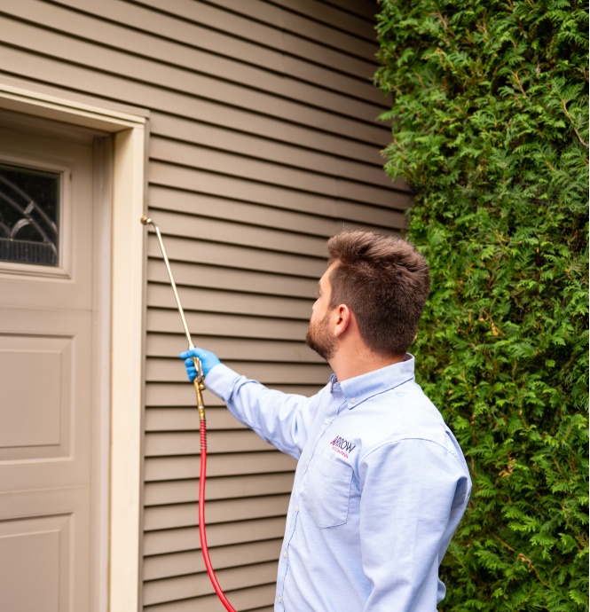 technician spraying for rodents